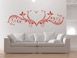 Wandtattoo Herz Ornament in rot ber dem Sofa