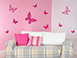 Schmetterlings-Schwarm Wandtattoo Set im Wohnzimmer in pink